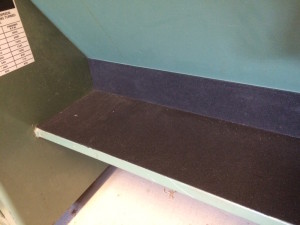 This is rubber mat, attached with carpet tape to protect the cutting edges